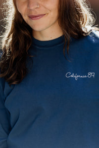 Unisex Long Sleeve Snowboard in Midnight, chest script